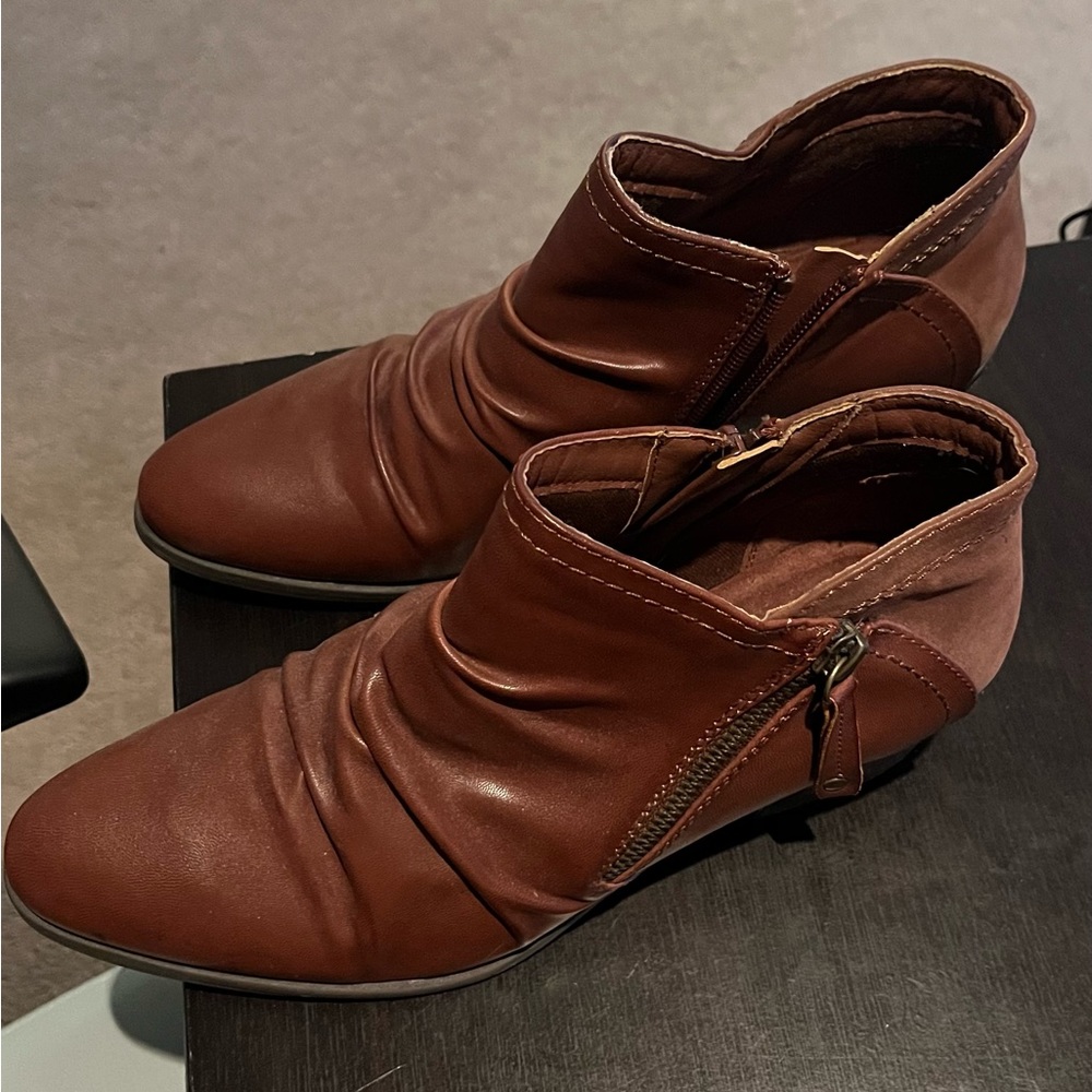 Women’s brown leather booties from Baretraps.